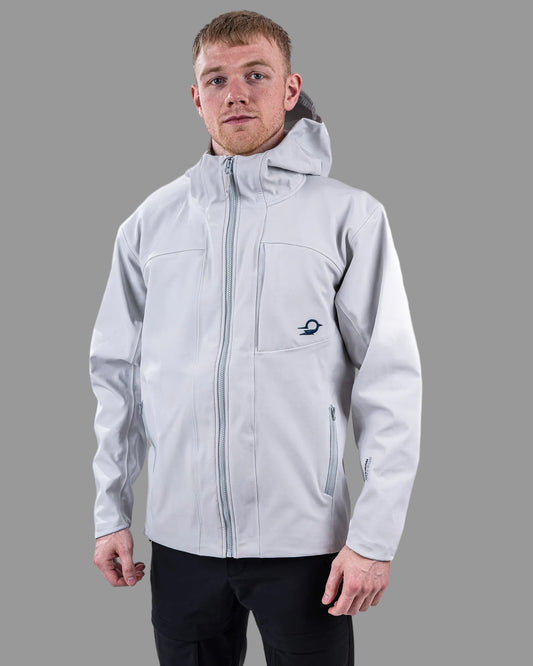 Person wearing a light gray jacket with a hood on a white background